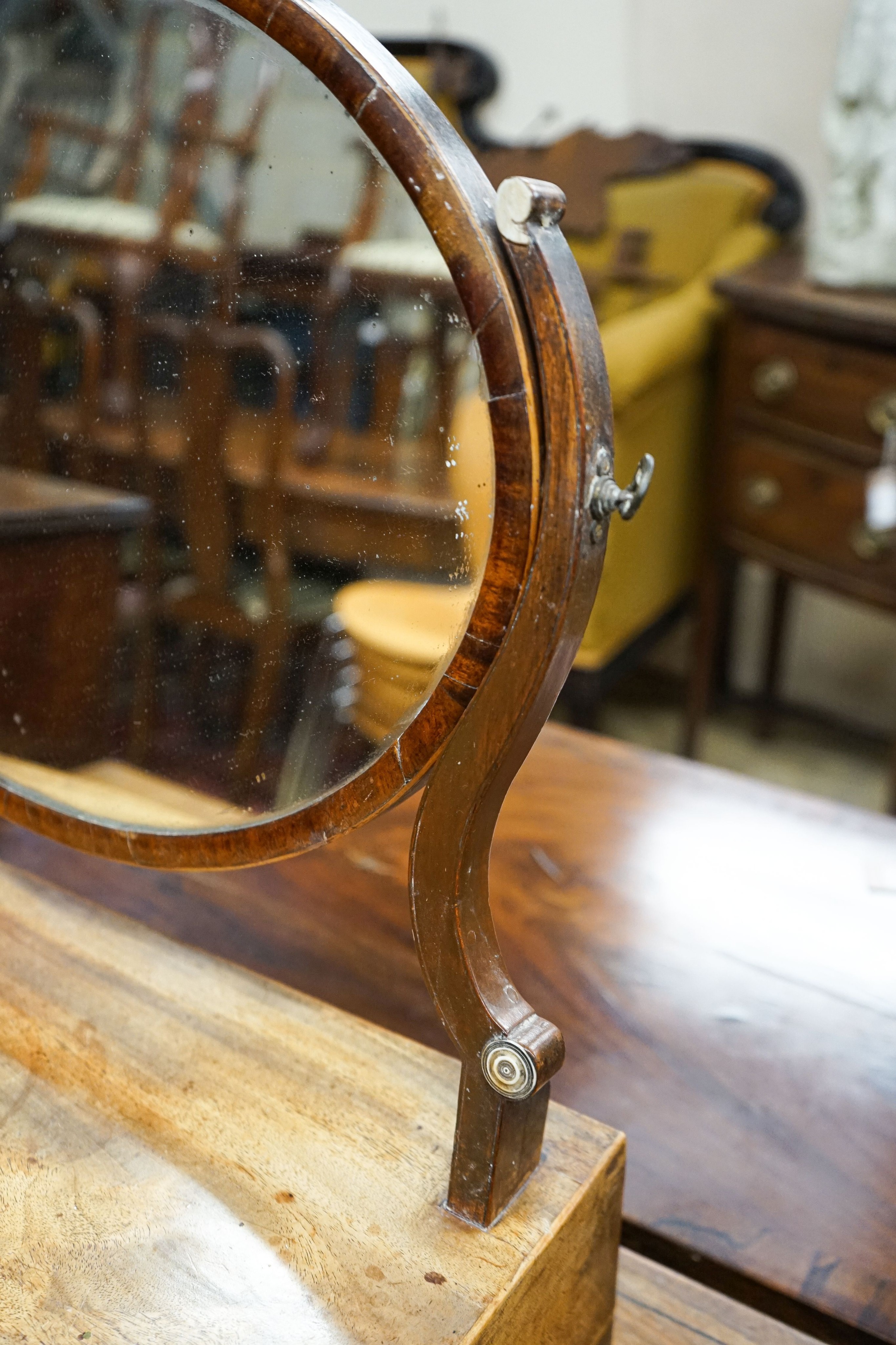 An early 19th century mahogany bowfront box base toilet mirror, width 54cm, depth 21cm, height 54cm